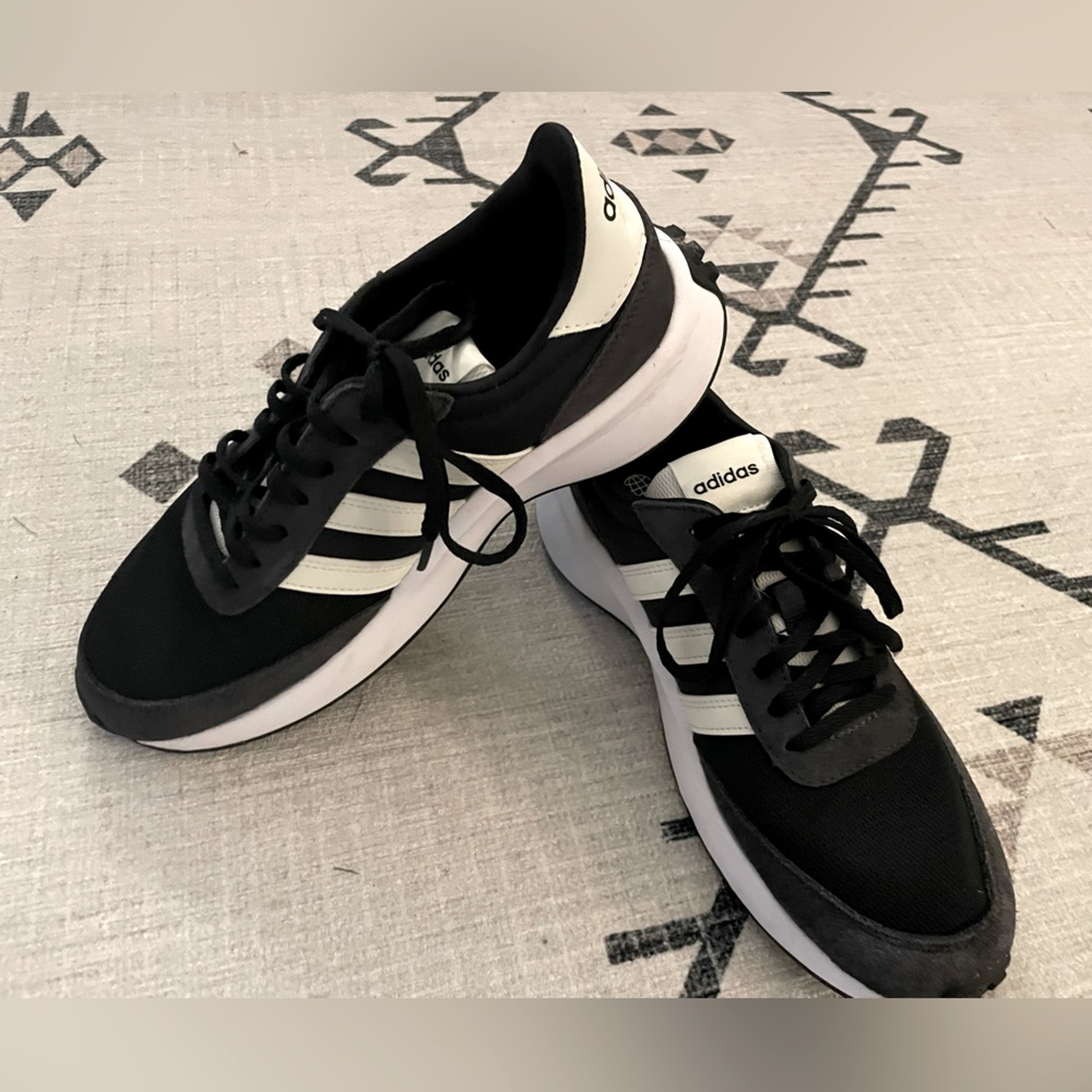 Size 8 woman's adidas shoes worn twice! Great condition just a little too big.